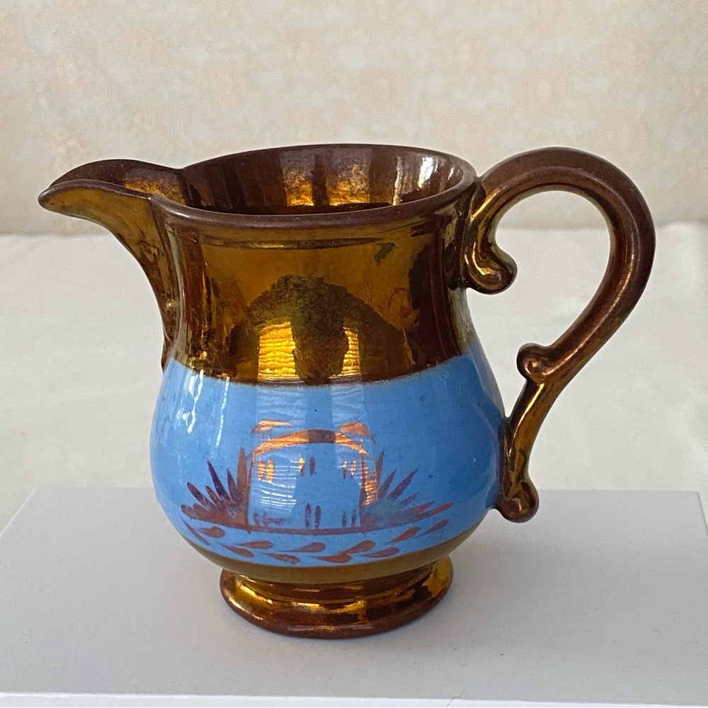 Lustreware Brown and Blue Ceramic pitcher glazed in copper. Circa 1800- 1850.